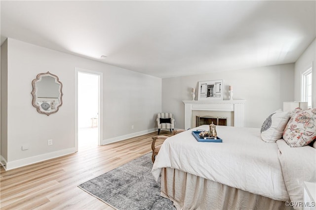 2613 Teaberry Dr, North Chesterfield, VA 23236 - bedroom featuring light wood-style flooring and a fireplace