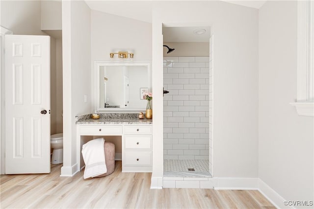 2613 Teaberry Dr, North Chesterfield, VA 23236 - bathroom featuring vanity, a tile shower, and wood finished floors