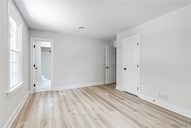 2613 Teaberry Dr, North Chesterfield, VA 23236 - empty room featuring light wood-style flooring and plenty of natural light