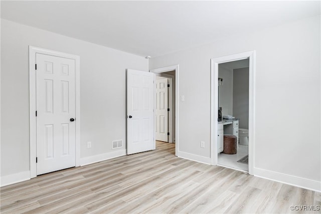 2613 Teaberry Dr, North Chesterfield, VA 23236 - unfurnished bedroom with light wood finished floors and ensuite bath