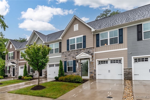 5845 Austin Woods Dr, North Chesterfield, VA 23234 - view of property with stone siding, a garage, concrete driveway, and board and batten siding