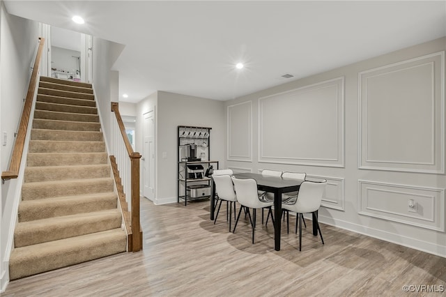 5845 Austin Woods Dr, North Chesterfield, VA 23234 - dining area with light wood-type flooring, stairs, and recessed lighting