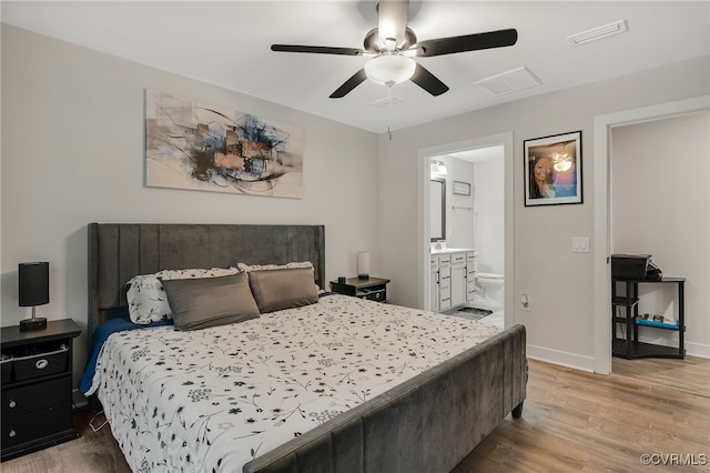 5845 Austin Woods Dr, North Chesterfield, VA 23234 - bedroom with wood finished floors, ensuite bathroom, and a ceiling fan