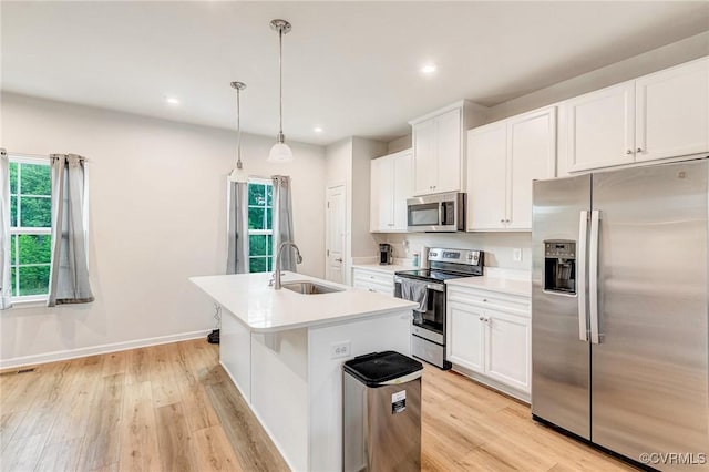 3119 Perdue Springs Dr, Chester, VA 23831 - kitchen featuring stainless steel appliances, an island with sink, light wood-type flooring, healthy amount of natural light, and recessed lighting