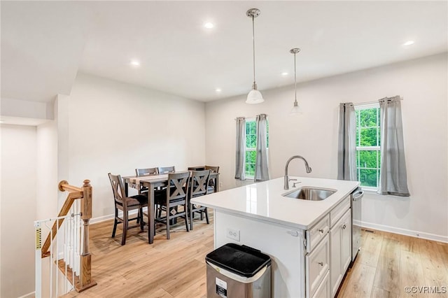 3119 Perdue Springs Dr, Chester, VA 23831 - kitchen featuring light wood-type flooring, light countertops, plenty of natural light, recessed lighting, and an island with sink