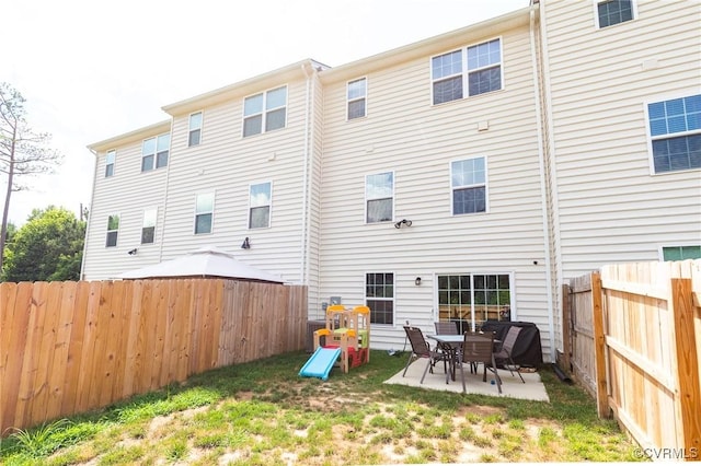 3119 Perdue Springs Dr, Chester, VA 23831 - back of property featuring a fenced backyard and a patio