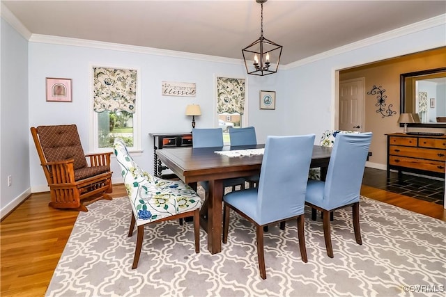 5618 Buxton Ct, Chester, VA 23831 - dining area featuring wood finished floors, crown molding, and a chandelier
