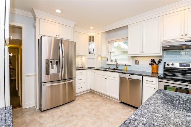 5618 Buxton Ct, Chester, VA 23831 - kitchen with stainless steel appliances, under cabinet range hood, ornamental molding, backsplash, and dark stone countertops