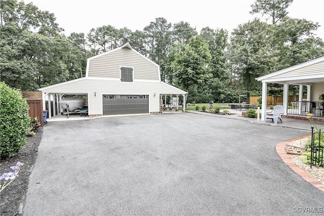 5618 Buxton Ct, Chester, VA 23831 - view of home's exterior with a garage, asphalt driveway, and view of wooded area