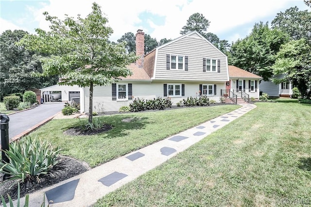 5618 Buxton Ct, Chester, VA 23831 - split level home with a gambrel roof, a garage, a chimney, a front yard, and roof with shingles
