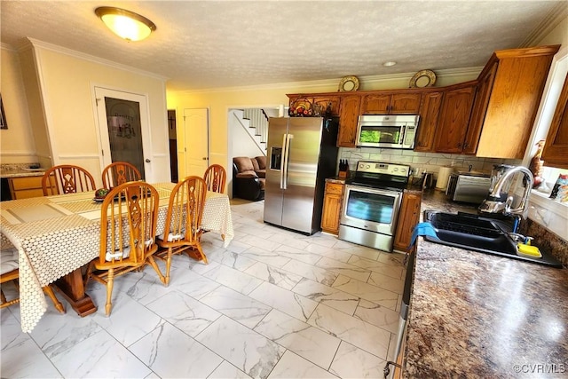 1932 Howardsville Tpke, Stuarts Draft, VA 24477 - kitchen featuring stainless steel appliances, light marble finish flooring, ornamental molding, tasteful backsplash, and a textured ceiling