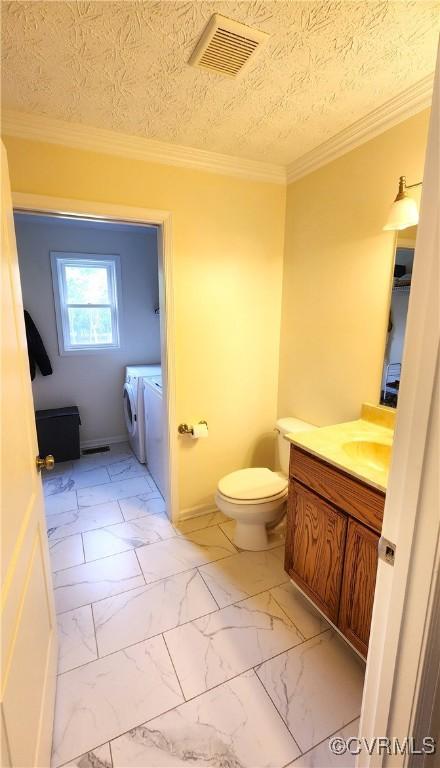 1932 Howardsville Tpke, Stuarts Draft, VA 24477 - bathroom with washer and dryer, vanity, marble finish flooring, and crown molding