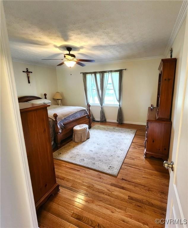 1932 Howardsville Tpke, Stuarts Draft, VA 24477 - bedroom featuring wood finished floors, a textured ceiling, ornamental molding, and ceiling fan