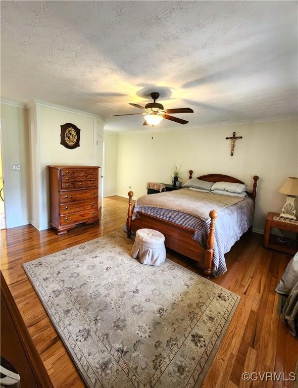 1932 Howardsville Tpke, Stuarts Draft, VA 24477 - bedroom with wood finished floors, ornamental molding, ceiling fan, and a textured ceiling