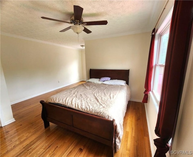 1932 Howardsville Tpke, Stuarts Draft, VA 24477 - bedroom with a textured ceiling, wood finished floors, multiple windows, crown molding, and a ceiling fan