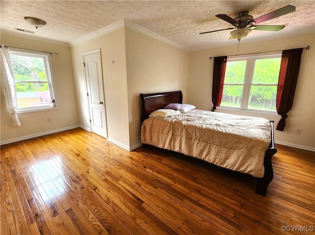 1932 Howardsville Tpke, Stuarts Draft, VA 24477 - bedroom with a textured ceiling, wood-type flooring, ornamental molding, and ceiling fan
