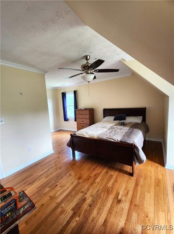 1932 Howardsville Tpke, Stuarts Draft, VA 24477 - bedroom featuring light wood-style floors, a textured ceiling, crown molding, and ceiling fan