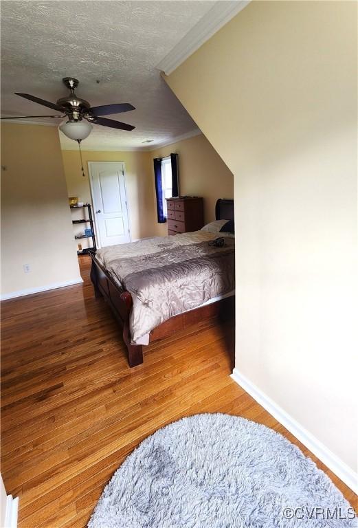 1932 Howardsville Tpke, Stuarts Draft, VA 24477 - bedroom with wood finished floors, crown molding, a ceiling fan, and a textured ceiling