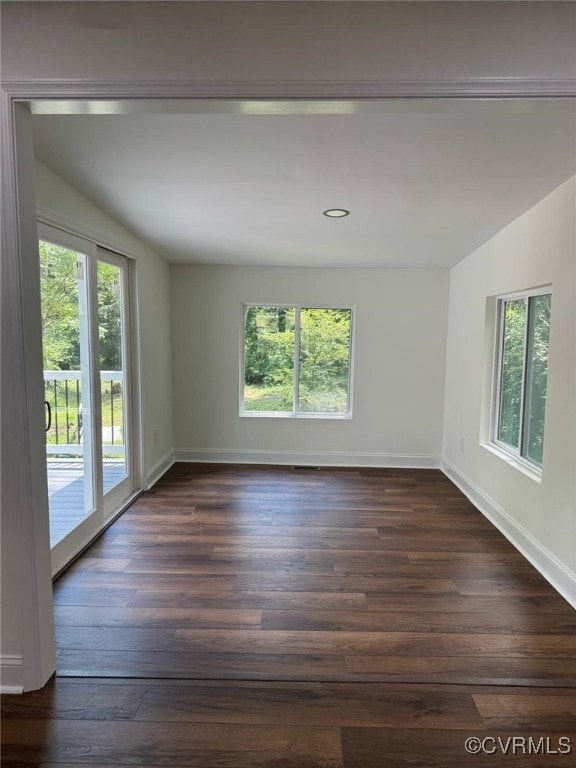 8057 Hermitage Rd, Henrico, VA 23228 - unfurnished room featuring healthy amount of natural light, dark wood-type flooring, recessed lighting, and vaulted ceiling