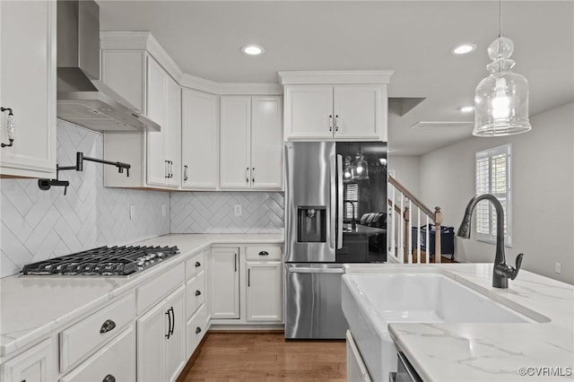 3391 Rock Creek Villa Dr, Quinton, VA 23141 - kitchen featuring wall chimney range hood, appliances with stainless steel finishes, white cabinets, and recessed lighting