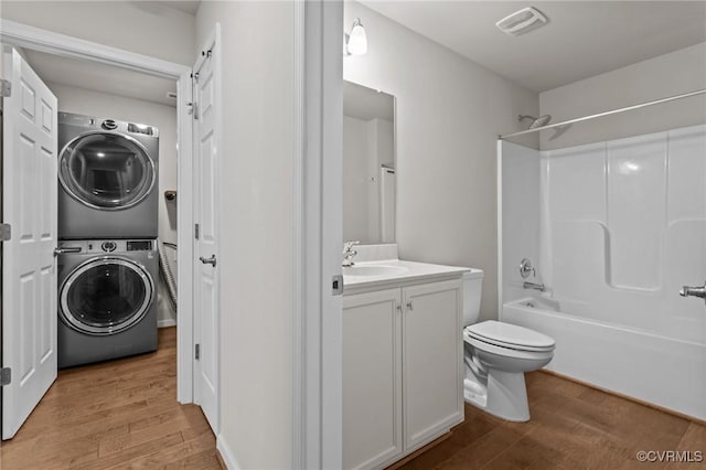 3391 Rock Creek Villa Dr, Quinton, VA 23141 - laundry room featuring estacked washer and dryer and light wood-type flooring