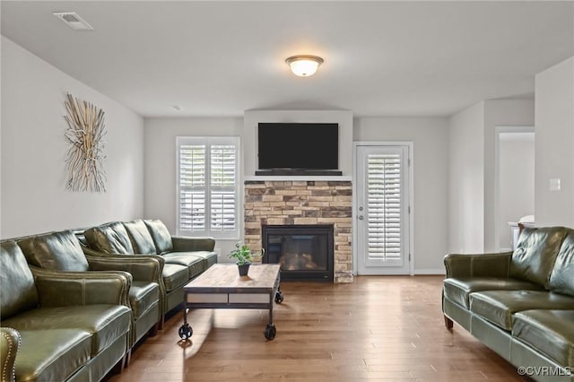 3391 Rock Creek Villa Dr, Quinton, VA 23141 - living room with a stone fireplace and wood finished floors