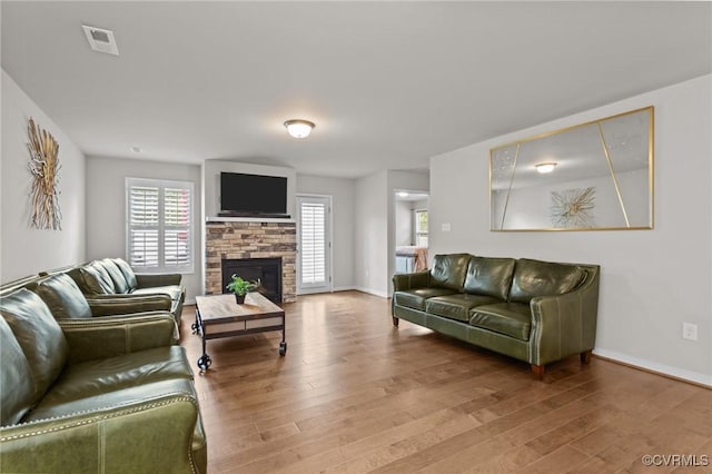 3391 Rock Creek Villa Dr, Quinton, VA 23141 - living room with wood finished floors and a stone fireplace