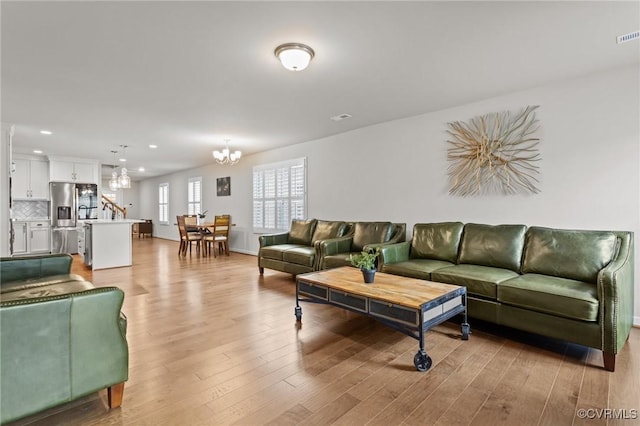 3391 Rock Creek Villa Dr, Quinton, VA 23141 - living area featuring a chandelier, light wood finished floors, and recessed lighting