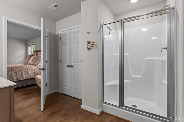 3391 Rock Creek Villa Dr, Quinton, VA 23141 - ensuite bathroom featuring a stall shower, wood finished floors, vanity, and a closet