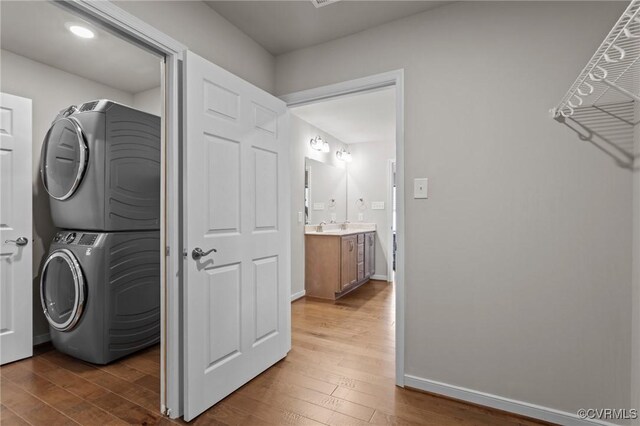 3391 Rock Creek Villa Dr, Quinton, VA 23141 - laundry room featuring stacked washing machine and dryer and wood finished floors
