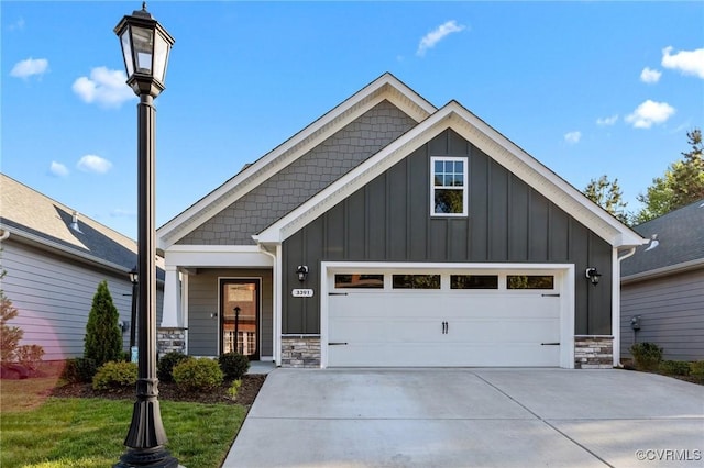 3391 Rock Creek Villa Dr, Quinton, VA 23141 - craftsman house featuring board and batten siding, stone siding, driveway, and a garage