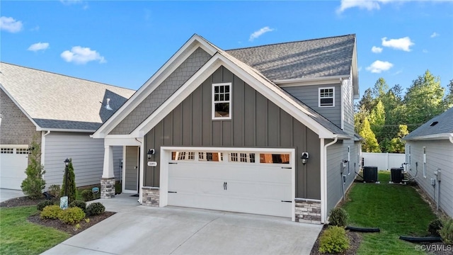 3391 Rock Creek Villa Dr, Quinton, VA 23141 - craftsman-style home with board and batten siding, stone siding, concrete driveway, and a shingled roof