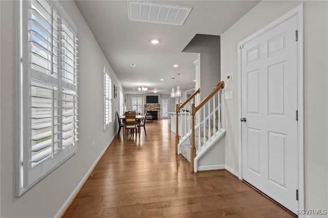 3391 Rock Creek Villa Dr, Quinton, VA 23141 - foyer with wood finished floors, stairs, recessed lighting, a fireplace, and a chandelier