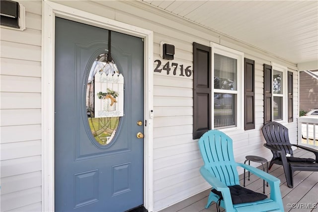 24716 Woodstream Ln, North Dinwiddie, VA 23803 - doorway to property featuring covered porch