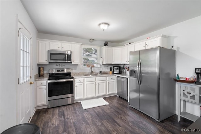24716 Woodstream Ln, North Dinwiddie, VA 23803 - kitchen with stainless steel appliances, white cabinets, dark wood-style floors, and light stone countertops