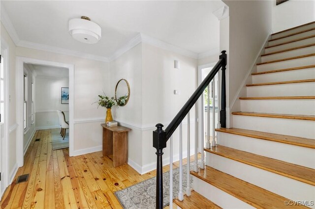 2712 Creek Edge, Powhatan, VA 23139 - stairway with hardwood / wood-style floors, ornamental molding, and a wainscoted wall