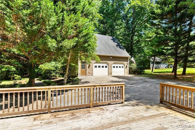 2712 Creek Edge, Powhatan, VA 23139 - wooden terrace featuring driveway, a garage, and an outdoor structure