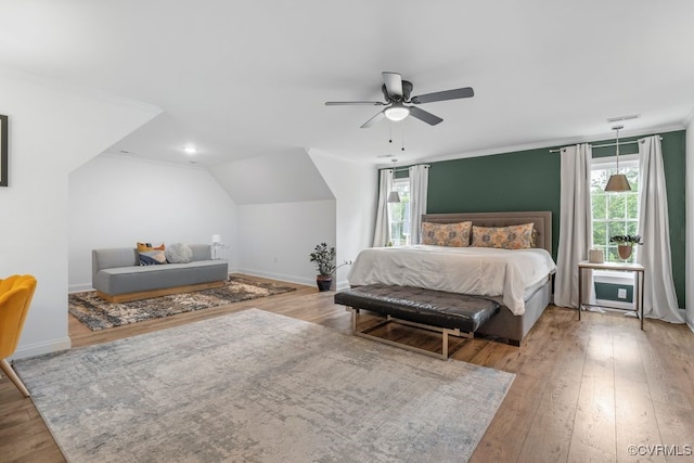 13518 Kelham Rd, Midlothian, VA 23113 - bedroom with hardwood / wood-style floors, multiple windows, vaulted ceiling, and ceiling fan