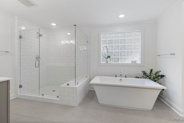 13518 Kelham Rd, Midlothian, VA 23113 - full bathroom with a soaking tub, ornamental molding, a shower stall, vanity, and tile patterned flooring