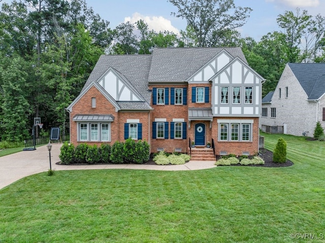 13518 Kelham Rd, Midlothian, VA 23113 - english style home featuring brick siding, a front lawn, stucco siding, and roof with shingles
