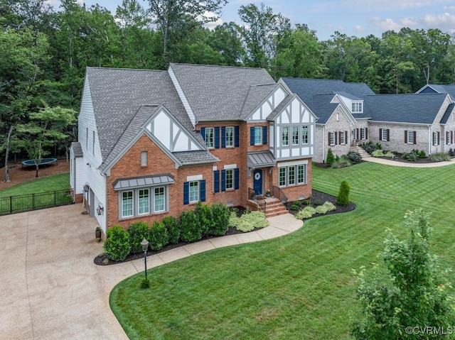 13518 Kelham Rd, Midlothian, VA 23113 - tudor house with driveway, brick siding, and roof with shingles