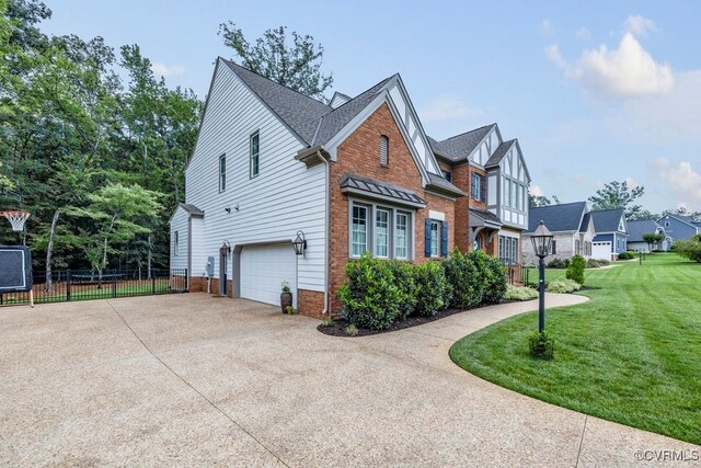 13518 Kelham Rd, Midlothian, VA 23113 - view of side of home featuring a garage, concrete driveway, brick siding, and a shingled roof