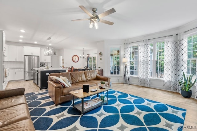 13518 Kelham Rd, Midlothian, VA 23113 - living room featuring a chandelier, ceiling fan, recessed lighting, and light wood-style flooring