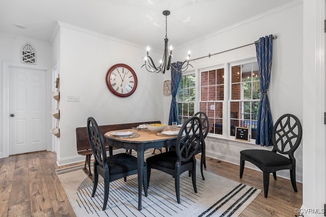13518 Kelham Rd, Midlothian, VA 23113 - dining area featuring crown molding, a chandelier, and light wood-type flooring