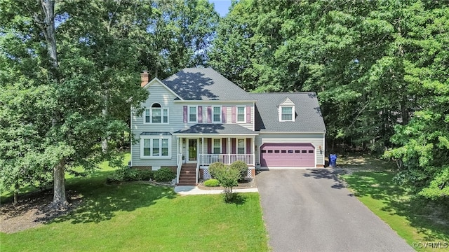 1424 Laurel Top Dr, Midlothian, VA 23114 - colonial house featuring a porch, asphalt driveway, a chimney, a front yard, and roof with shingles