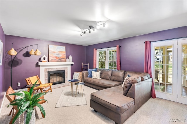 1424 Laurel Top Dr, Midlothian, VA 23114 - carpeted living area featuring a fireplace with flush hearth and rail lighting