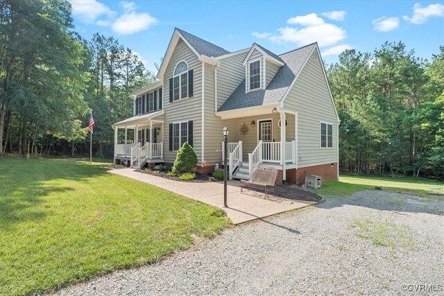 2551 Walkers Ridge Cir, Powhatan, VA 23139 - view of front of house with covered porch, roof with shingles, a front yard, and crawl space