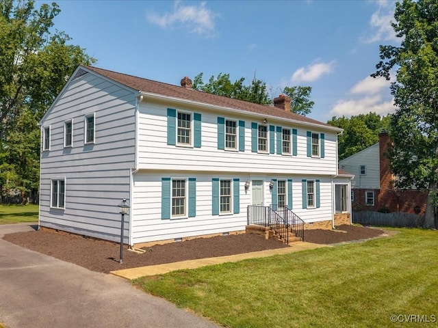 2340 Scarsborough Dr, North Chesterfield, VA 23235 - colonial-style house featuring a chimney, a front yard, and crawl space