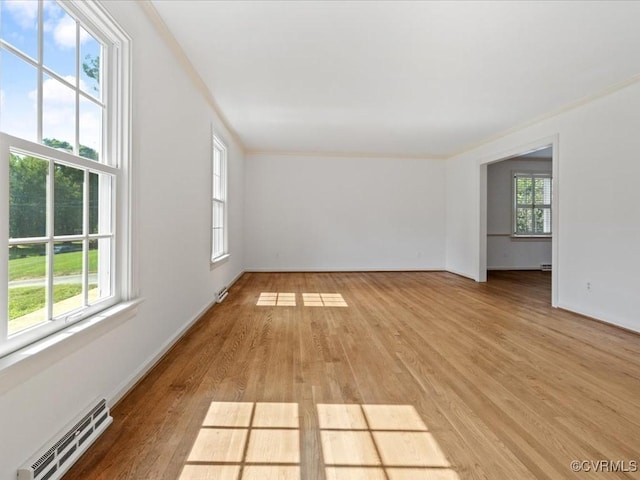 2340 Scarsborough Dr, North Chesterfield, VA 23235 - unfurnished room featuring light wood-style floors, baseboard heating, and ornamental molding
