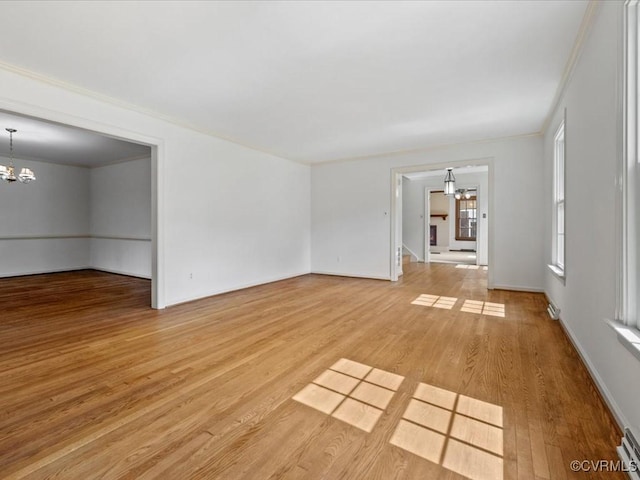 2340 Scarsborough Dr, North Chesterfield, VA 23235 - unfurnished room featuring a chandelier, light wood finished floors, crown molding, and a baseboard radiator